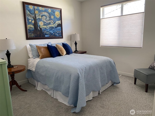 bedroom featuring baseboards and carpet floors