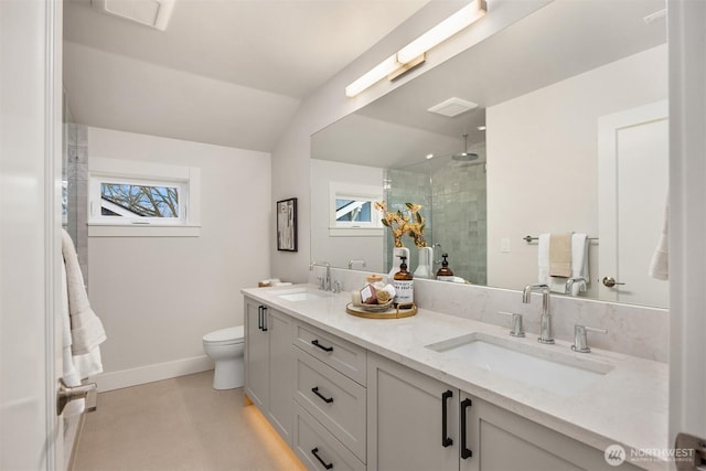 full bathroom with plenty of natural light, a stall shower, and a sink