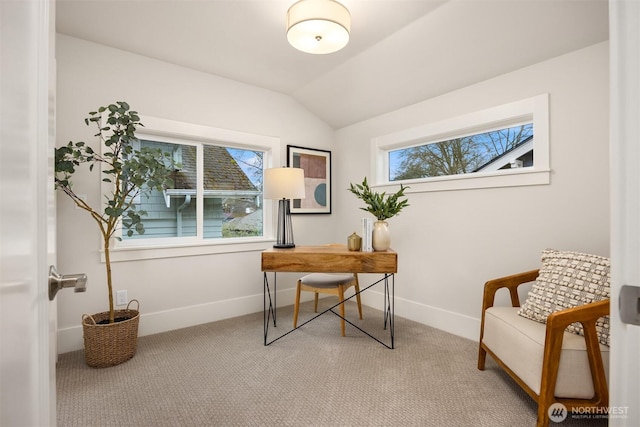 carpeted office with baseboards and lofted ceiling