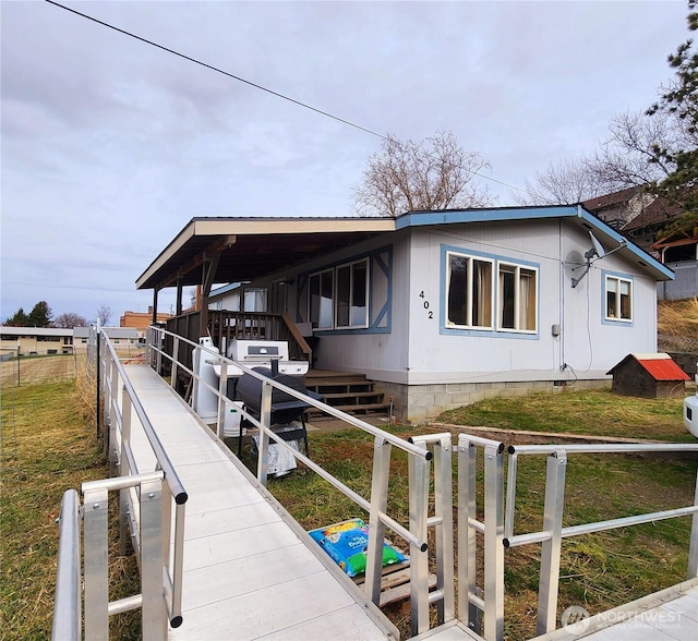 exterior space with fence and crawl space