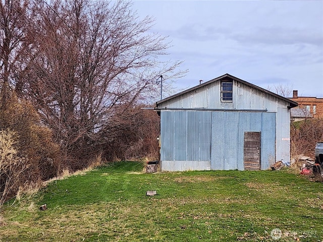 view of pole building with a yard