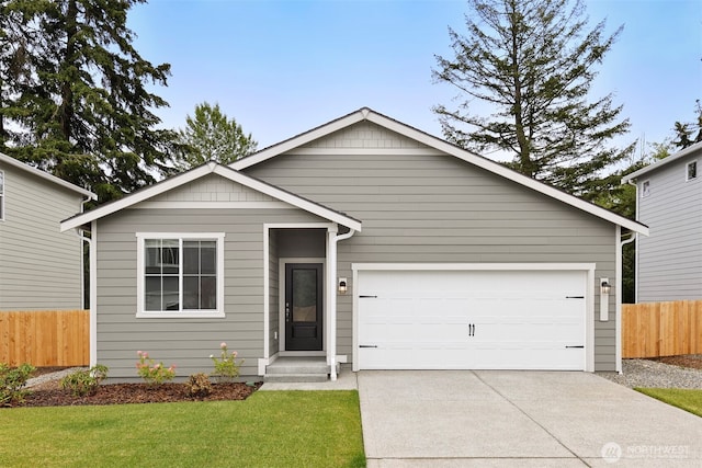 ranch-style house with a front lawn, fence, a garage, and driveway