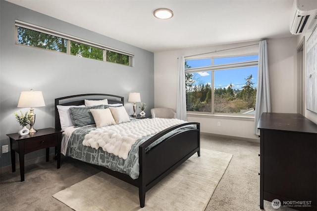 bedroom featuring baseboards, light colored carpet, and a wall mounted AC