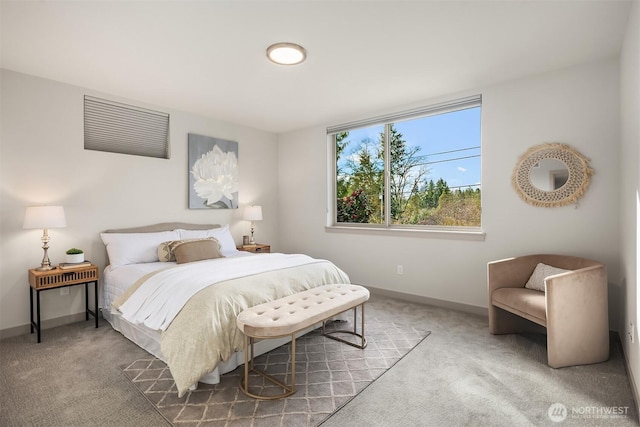 carpeted bedroom featuring baseboards