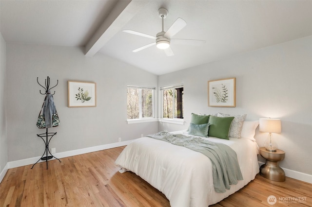 bedroom with vaulted ceiling with beams, a ceiling fan, baseboards, and wood finished floors