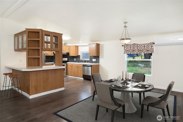 dining area with baseboards, dark wood-type flooring, and an AC wall unit