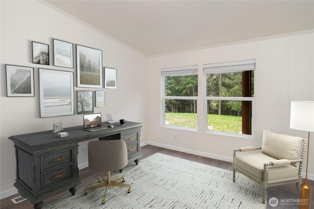 office area with visible vents, baseboards, wood finished floors, and crown molding