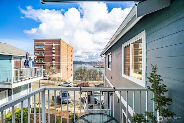 balcony featuring a water view