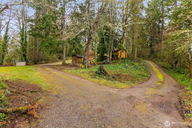 view of road with driveway