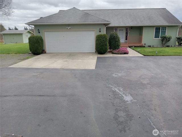 single story home featuring a garage, a porch, concrete driveway, and a front yard