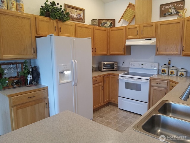 kitchen with white appliances, a toaster, a sink, light countertops, and under cabinet range hood