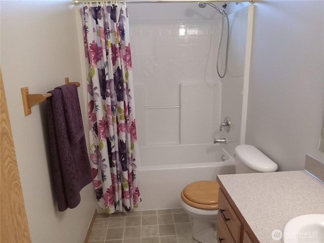 full bath with tile patterned floors, shower / bathtub combination with curtain, toilet, and vanity