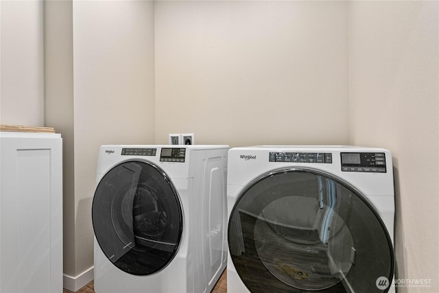 laundry area with independent washer and dryer and laundry area