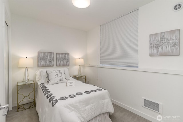 bedroom featuring visible vents, carpet flooring, and baseboards