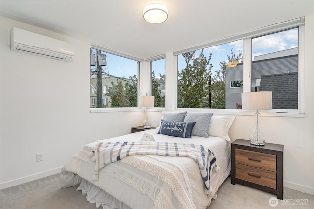 carpeted bedroom featuring a wall mounted AC and baseboards