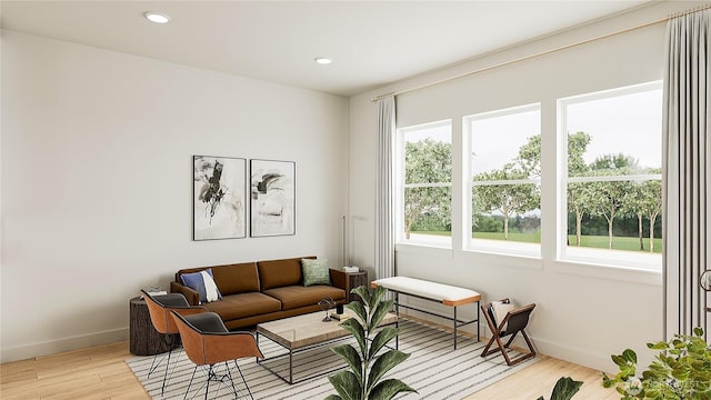 living room featuring recessed lighting, baseboards, and light wood finished floors