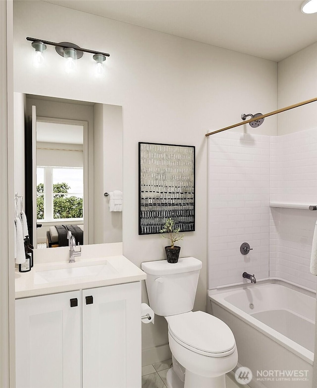 bathroom with toilet, vanity, and shower / tub combination