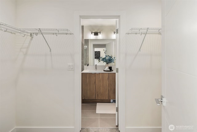 spacious closet with a sink