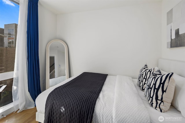 bedroom with wood finished floors