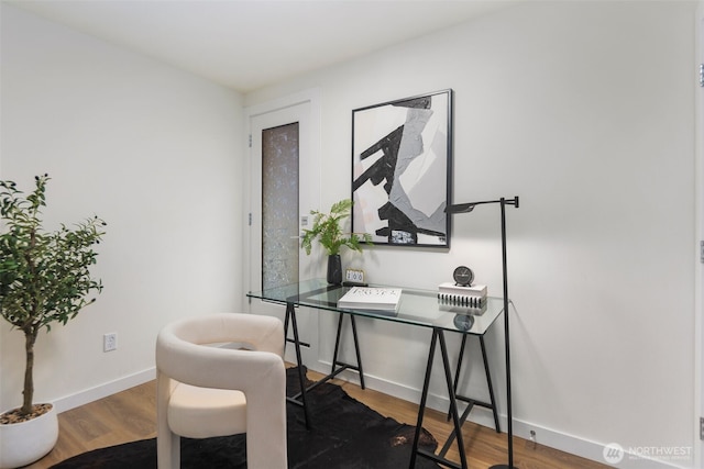 home office featuring wood finished floors and baseboards