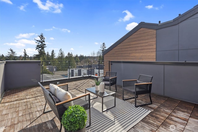 view of patio with an outdoor living space and a balcony