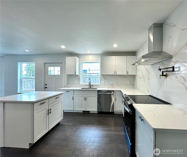 kitchen featuring electric range, a sink, stainless steel dishwasher, wall chimney range hood, and backsplash