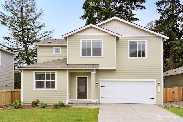 traditional-style home featuring a shingled roof, concrete driveway, a garage, and fence