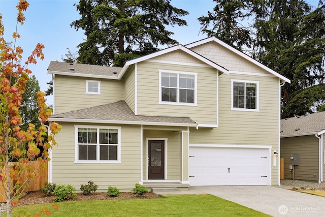 traditional-style house with driveway, roof with shingles, an attached garage, and fence