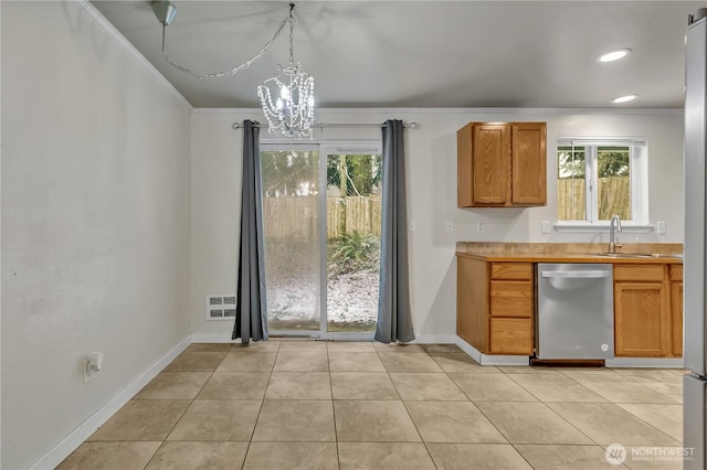 kitchen featuring a sink, dishwasher, a chandelier, and crown molding