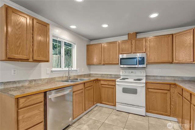 kitchen featuring ornamental molding, recessed lighting, appliances with stainless steel finishes, light tile patterned flooring, and a sink