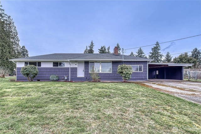 ranch-style house featuring a front lawn, driveway, and a chimney