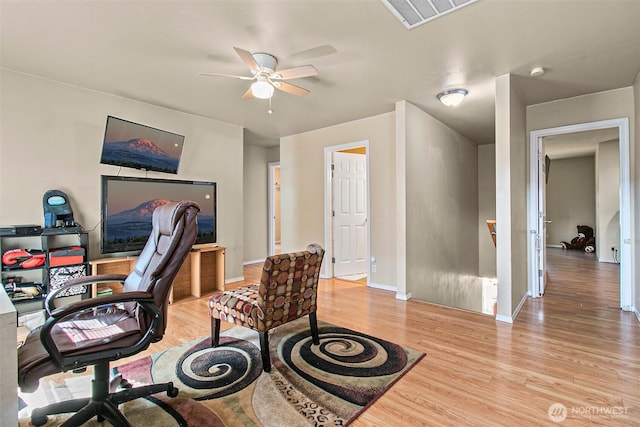 office with visible vents, ceiling fan, baseboards, and light wood-style floors