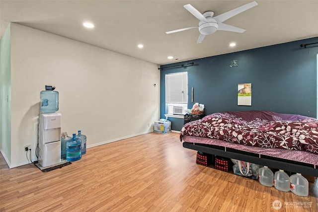 bedroom featuring recessed lighting, baseboards, and wood finished floors