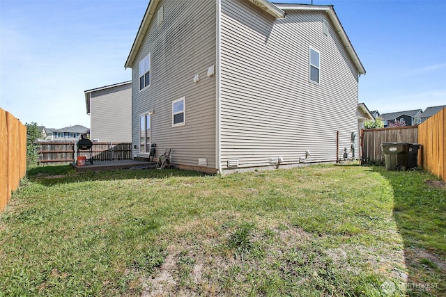 view of home's exterior featuring a yard, a patio, and a fenced backyard