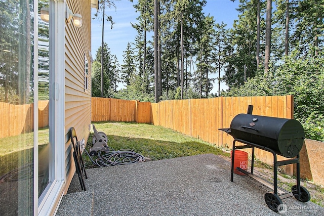 view of patio / terrace with a grill and a fenced backyard