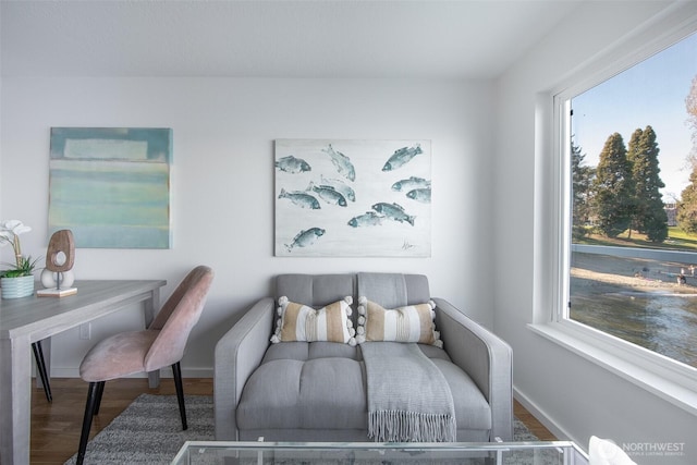 bedroom with wood finished floors and baseboards