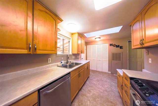 kitchen with brown cabinets, a sink, stainless steel appliances, a skylight, and light countertops