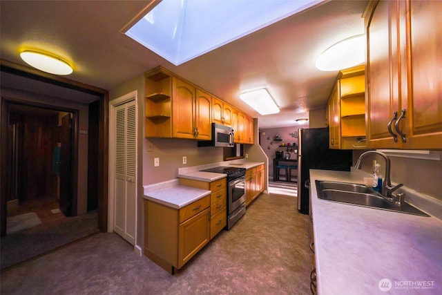 kitchen featuring a sink, open shelves, light countertops, and stainless steel appliances