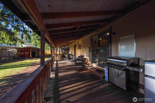 wooden deck with outdoor dining space