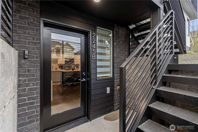 entrance to property with brick siding