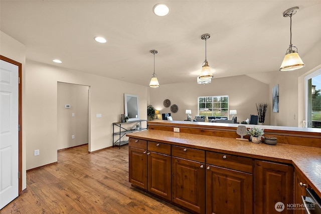 kitchen featuring recessed lighting, baseboards, pendant lighting, and wood finished floors