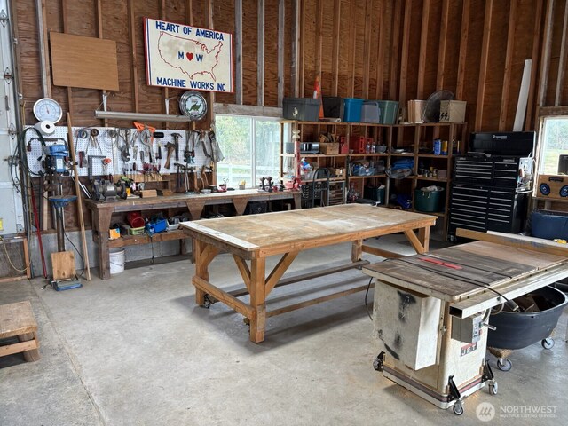 misc room featuring concrete floors and a workshop area