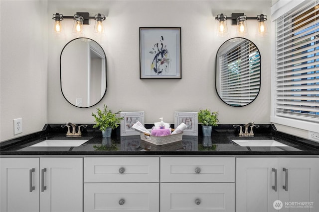 bathroom featuring double vanity and a sink