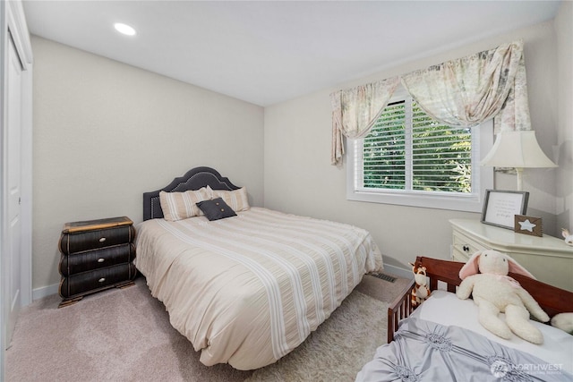 bedroom with recessed lighting, baseboards, visible vents, and carpet floors