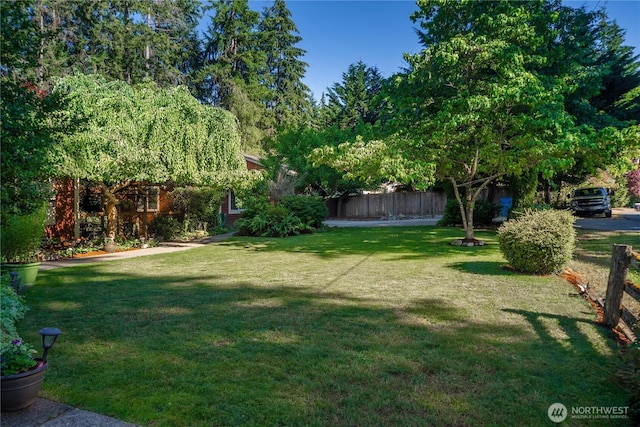 view of yard with fence