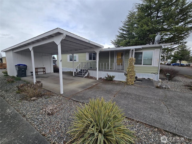 view of front of home with a porch and driveway