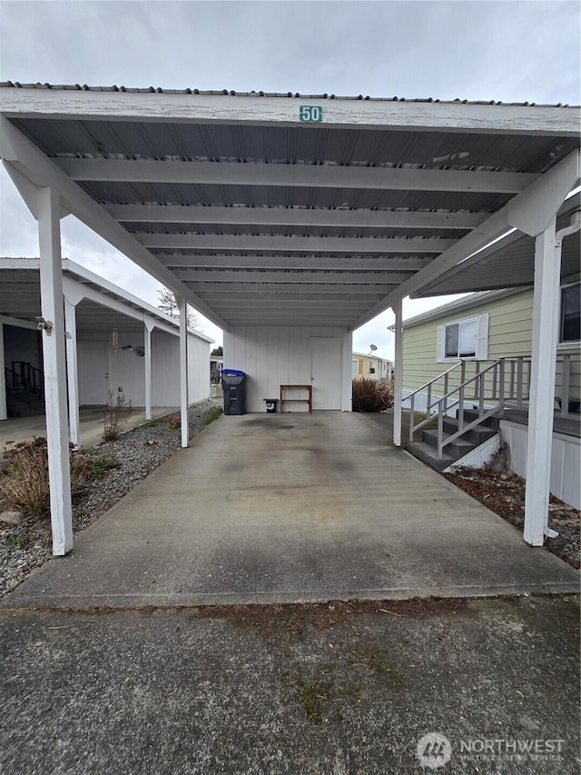 view of parking featuring an attached carport