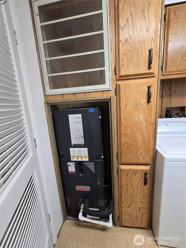 interior space with washer / clothes dryer, cabinet space, and visible vents