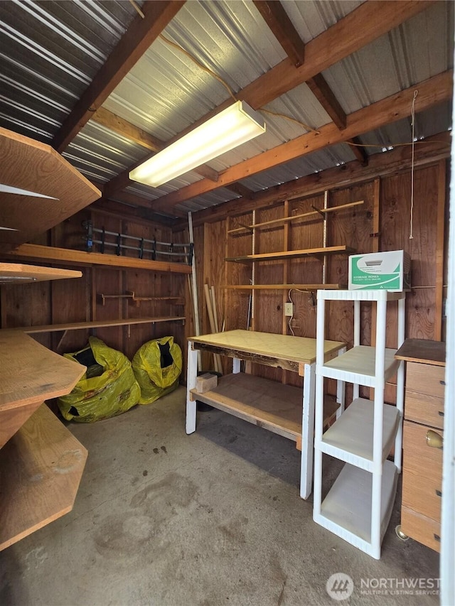 miscellaneous room with unfinished concrete flooring