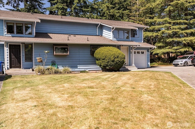 1234 NW Lanyard Loop Unit 1, Oak Harbor, WA 98277 - view of front of property with concrete driveway, a front yard, and an attached garage